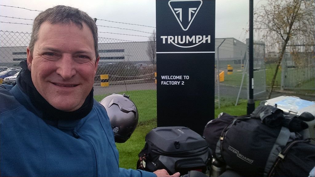 Standing in front of the Triumph Factory in England